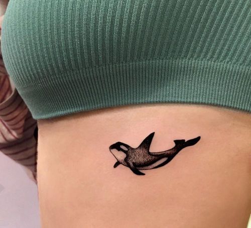 Shark in between breast tattoo