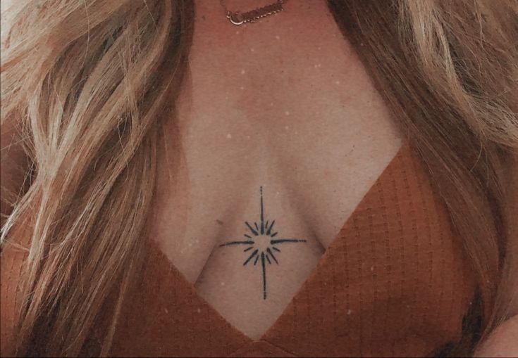 Tiny star symbol tattoo