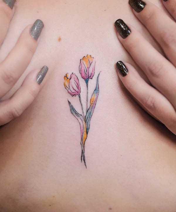 Rainbow tulip in between breast tattoo design