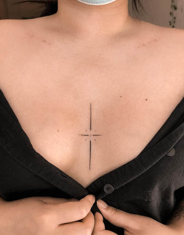 Small in between breast tattoo