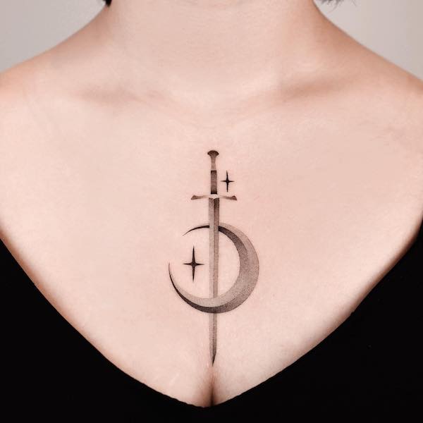 Moon and Sword in between breast  tattoo