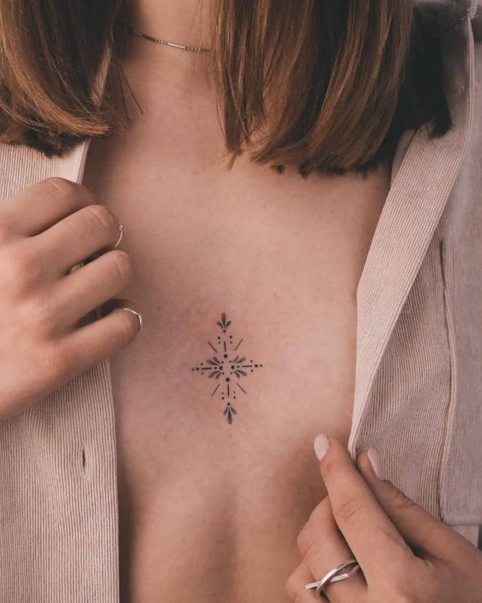 Tiny star symbol tattoo